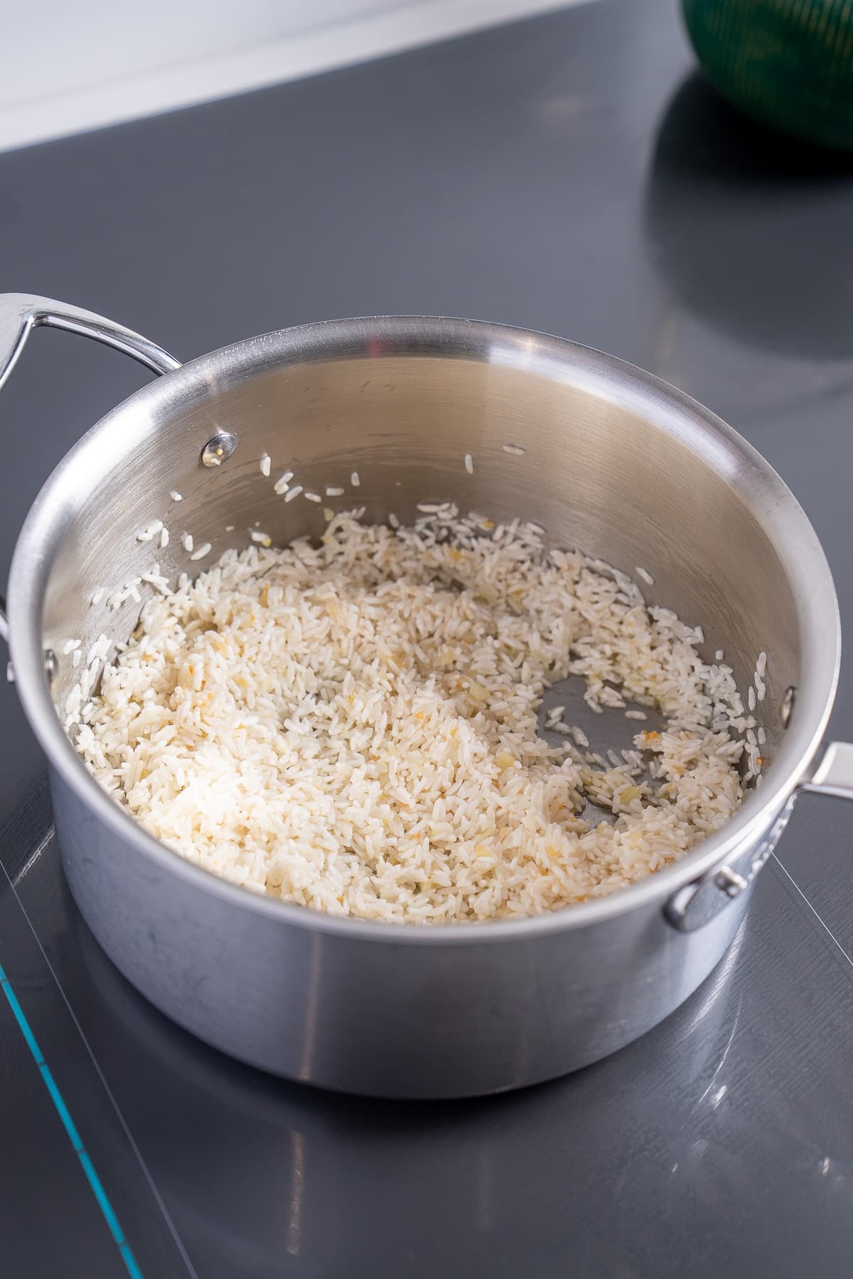rice being cooked in garlic and butter