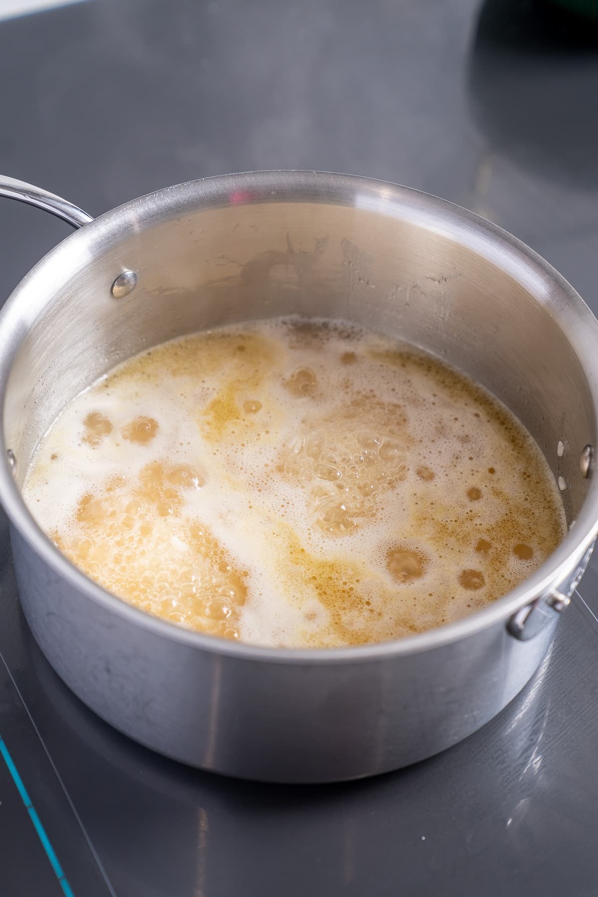 chicken broth boiling in pot