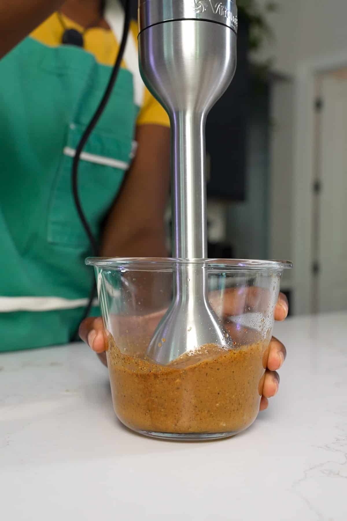 Stick blender blending marinade for Peruvian chicken.