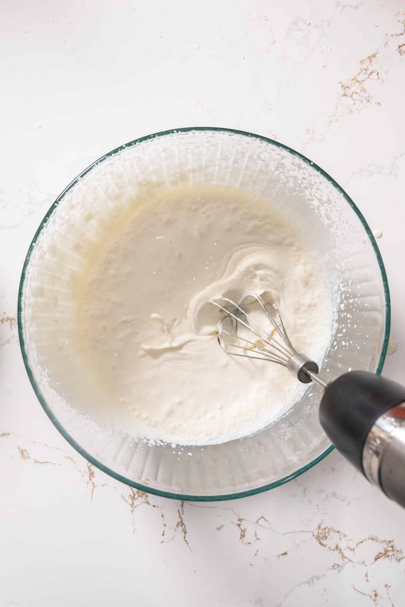 Cream in a bowl being whipped