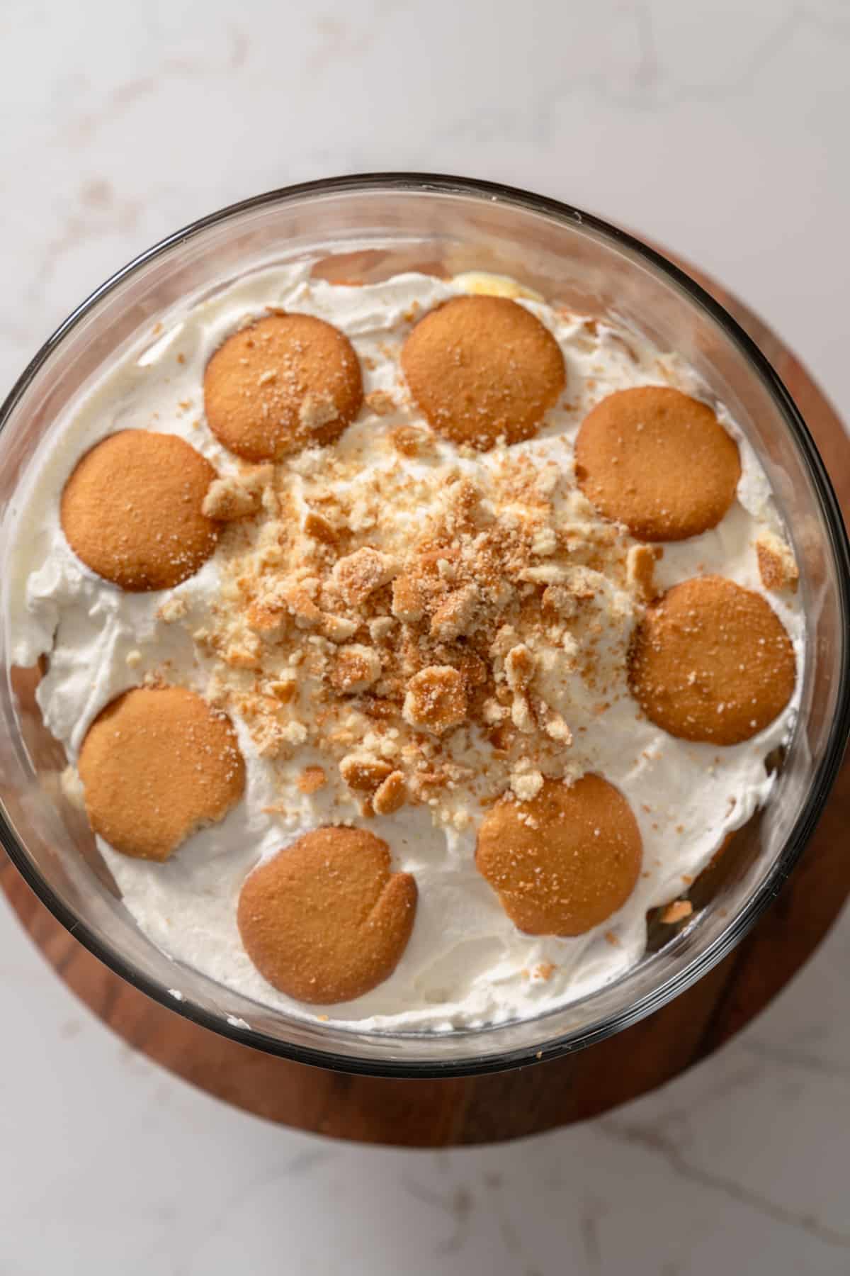 The top of the banana pudding with crushed Nilla wafers and whipped cream on top