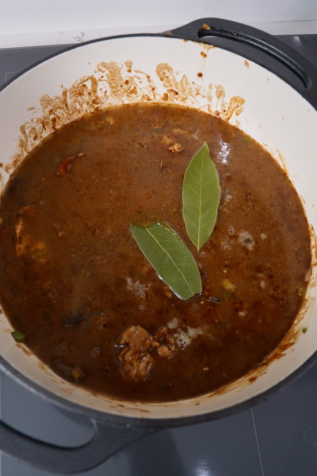 Gumbo and Pop with bay leaves before simmering