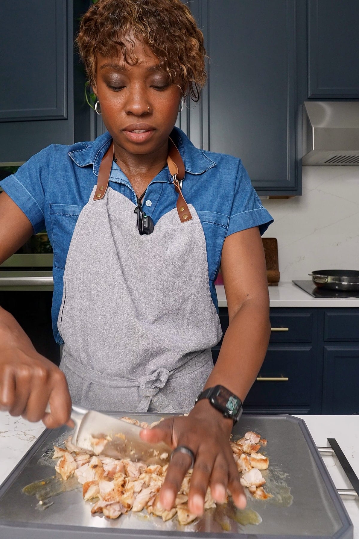 Tanya chopping chicken after searing