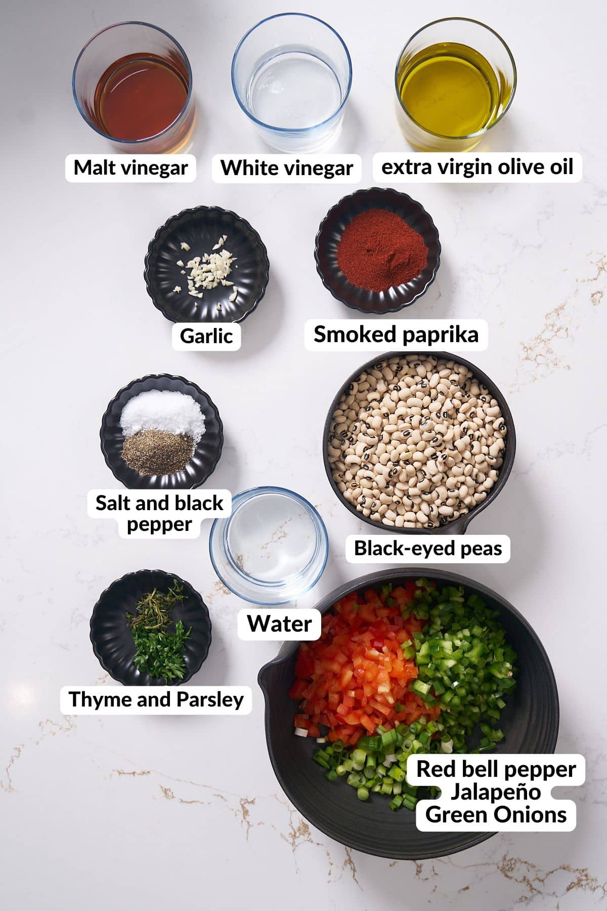 Ingredients for black eyed pea salad on table.