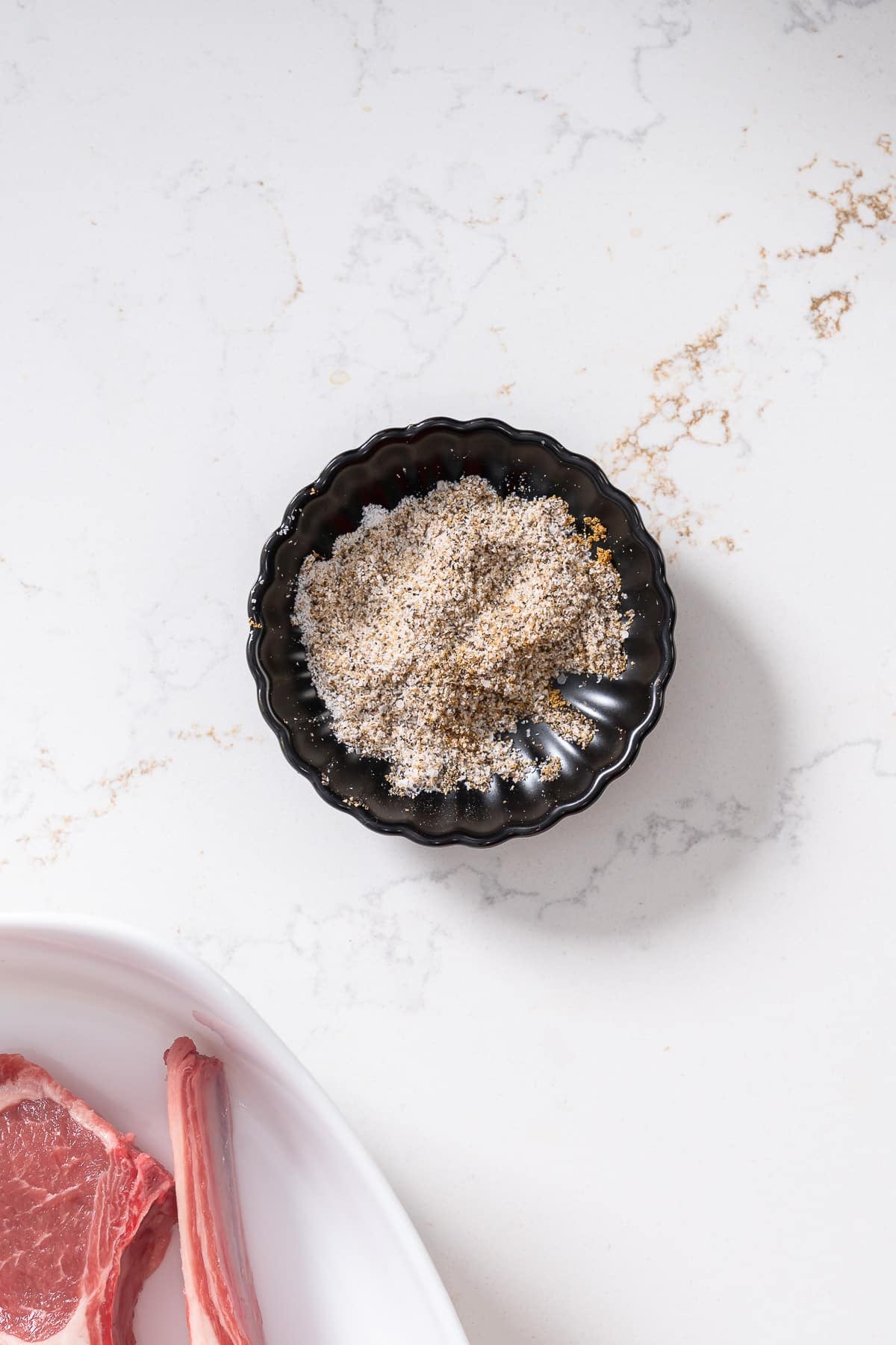 Seasonings mixed in smalll bowl.