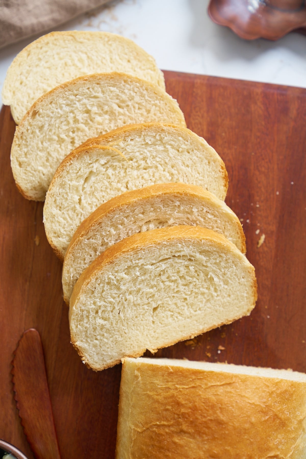 hard dough bread on cutting board with slices cuts