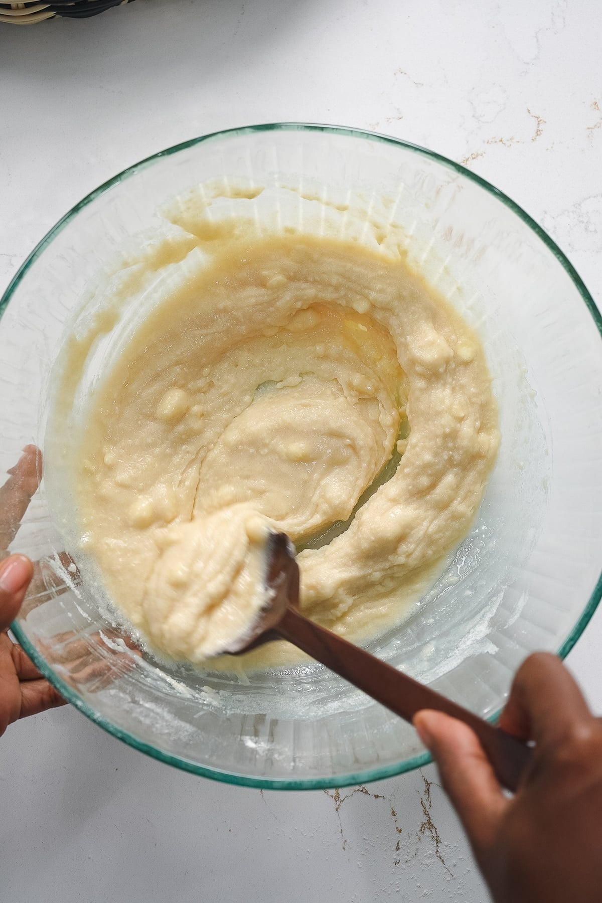 Mixing biscuit dough in glass bowl
