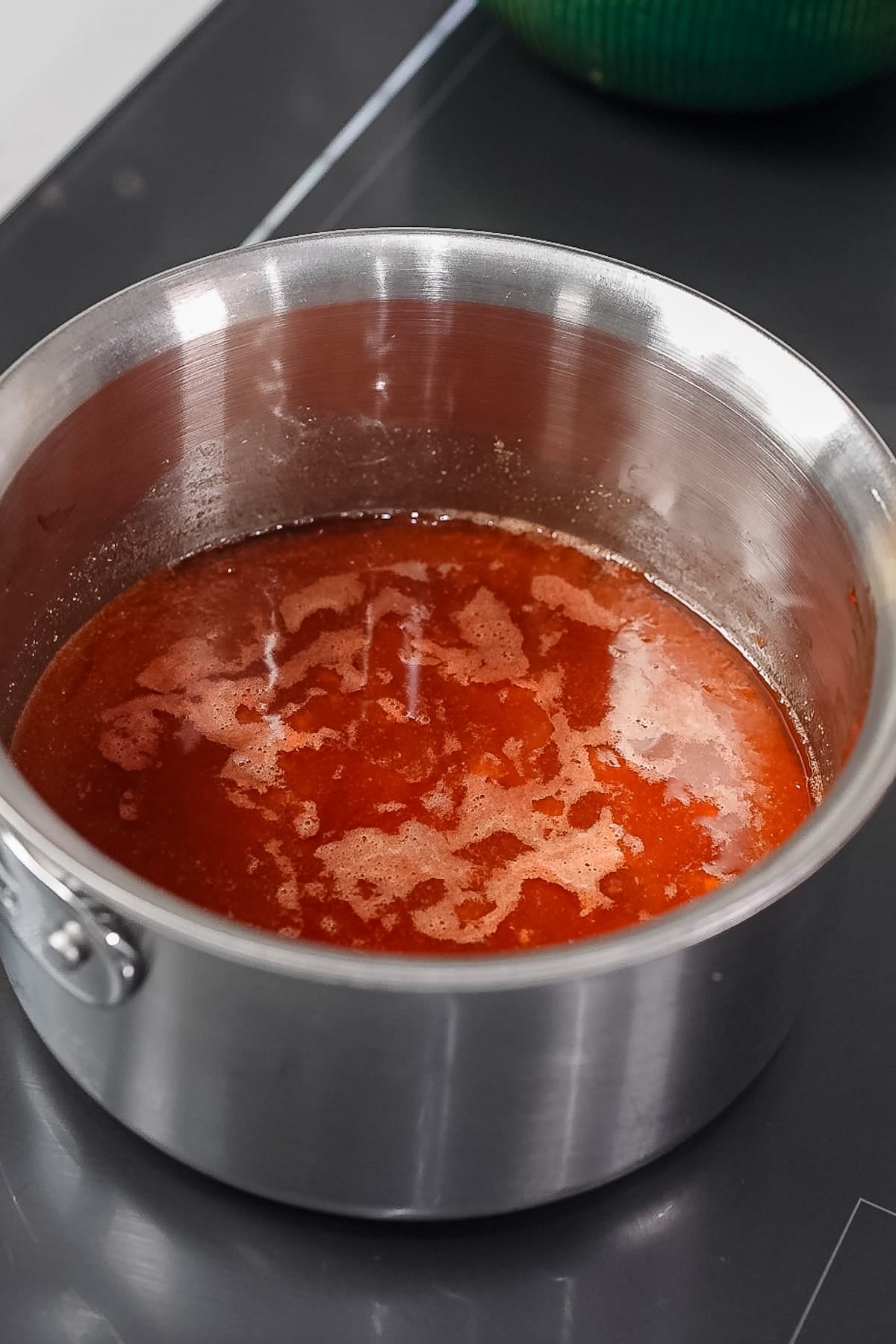 sauce simmering on stove
