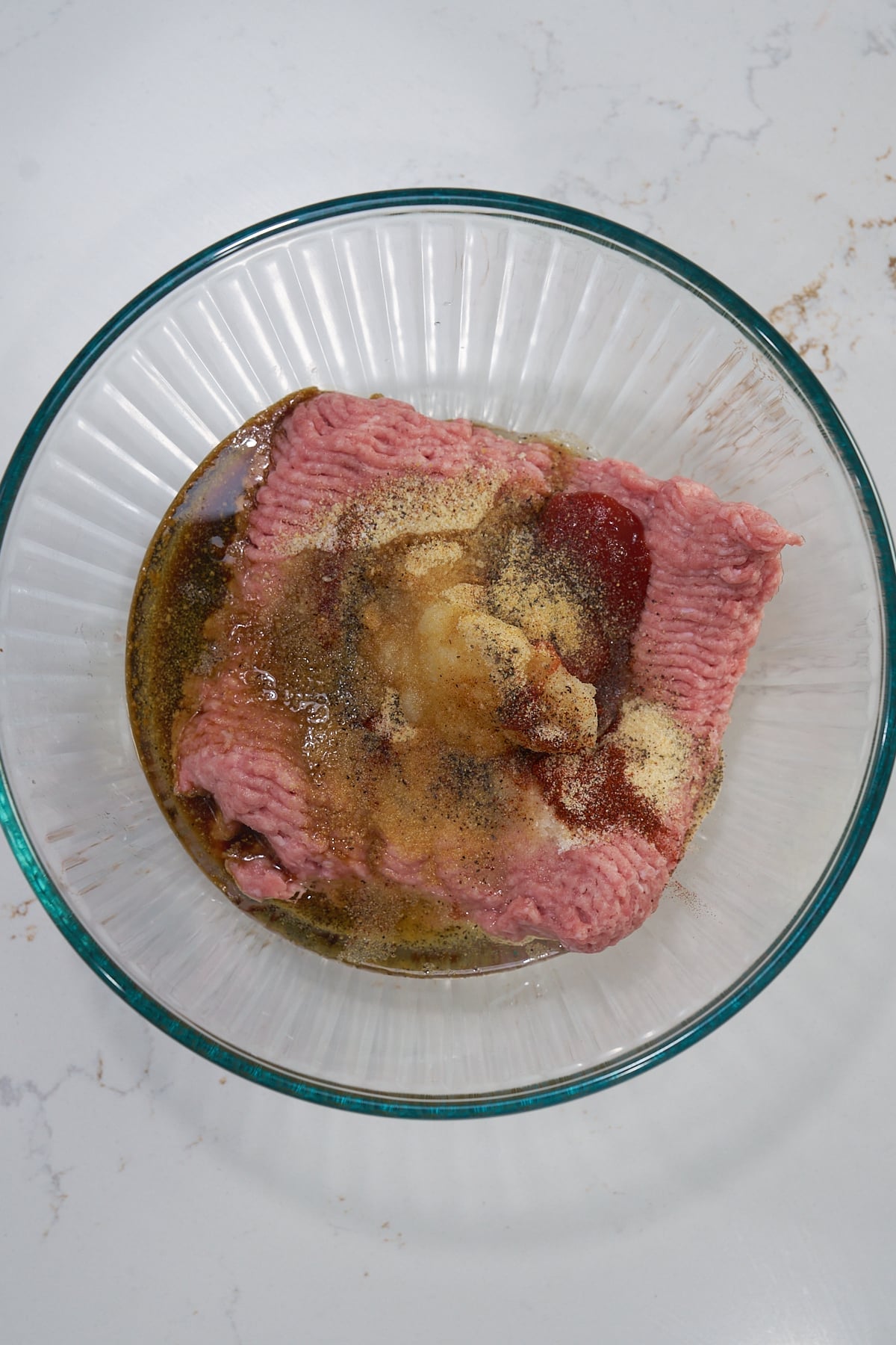 ground turkey with seasoning in bowl