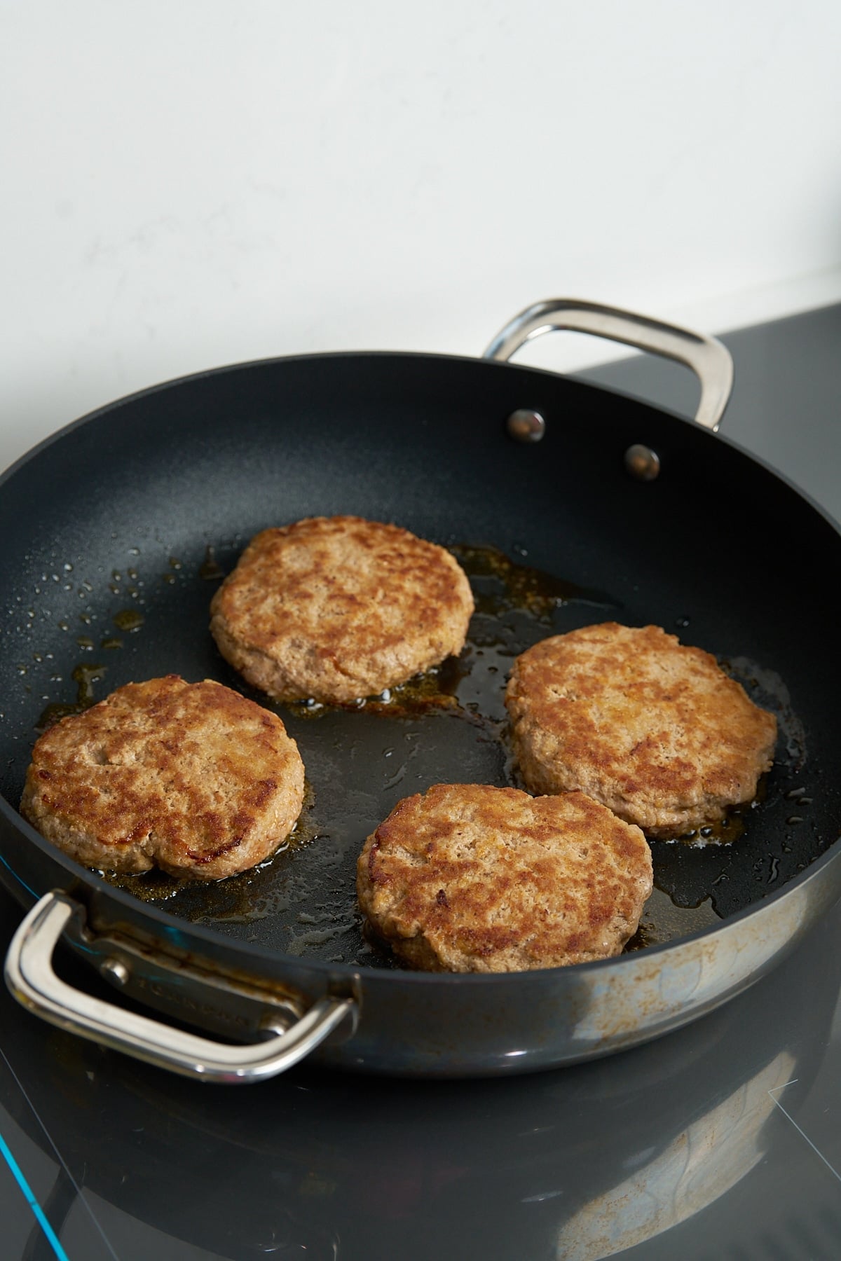 flipped and cooked turkey burgers in basket