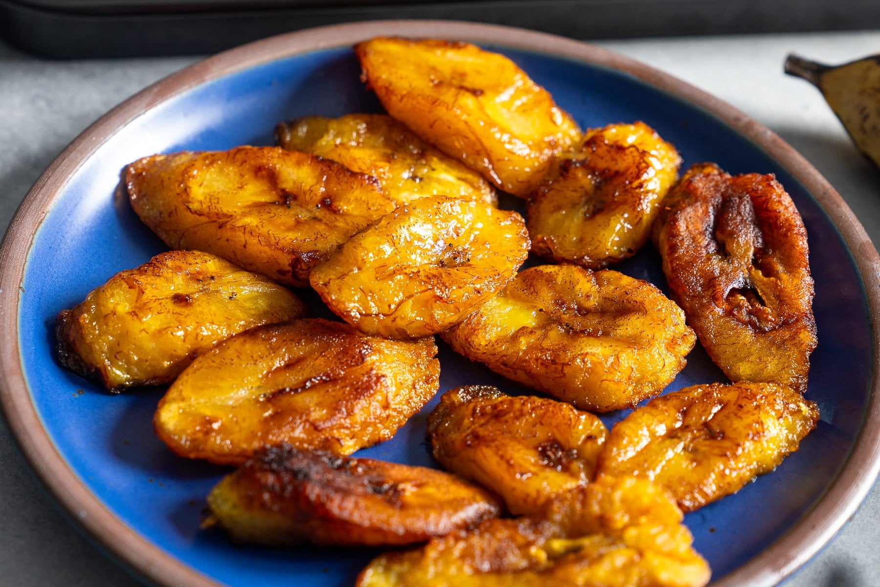 fried plantains on blue plate