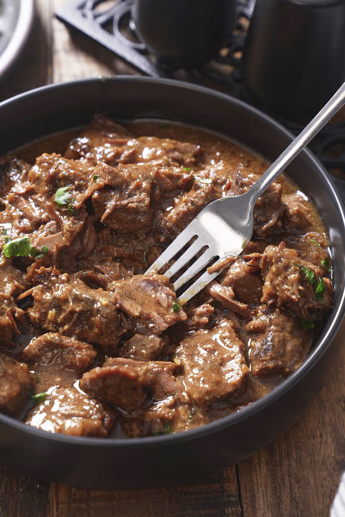 beef tips with fork sliding in to pick it up