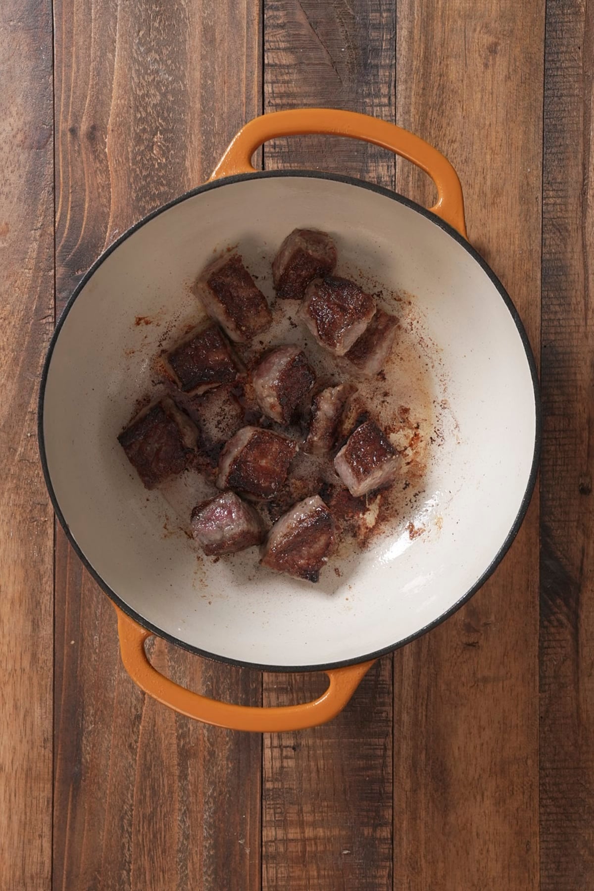 beef tips searing in pot
