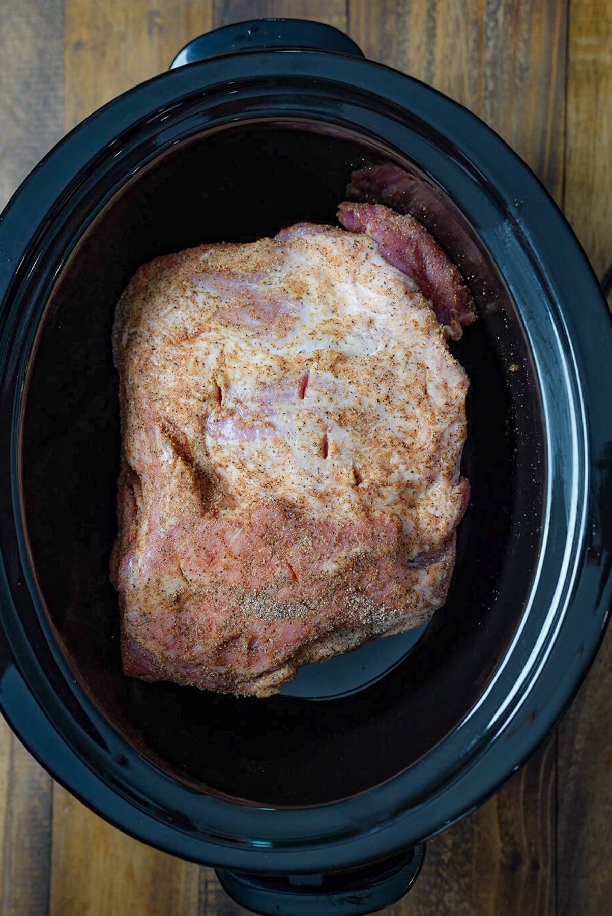 Raw pork and slow cooker insert