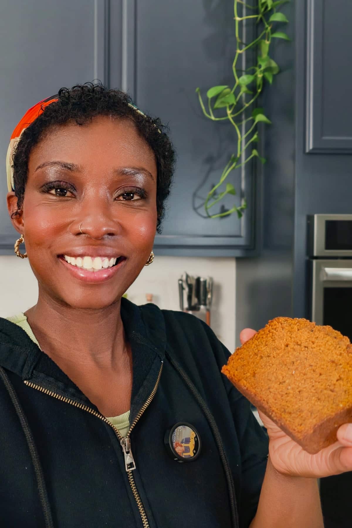 Tanya holding slice of pumpkin bread