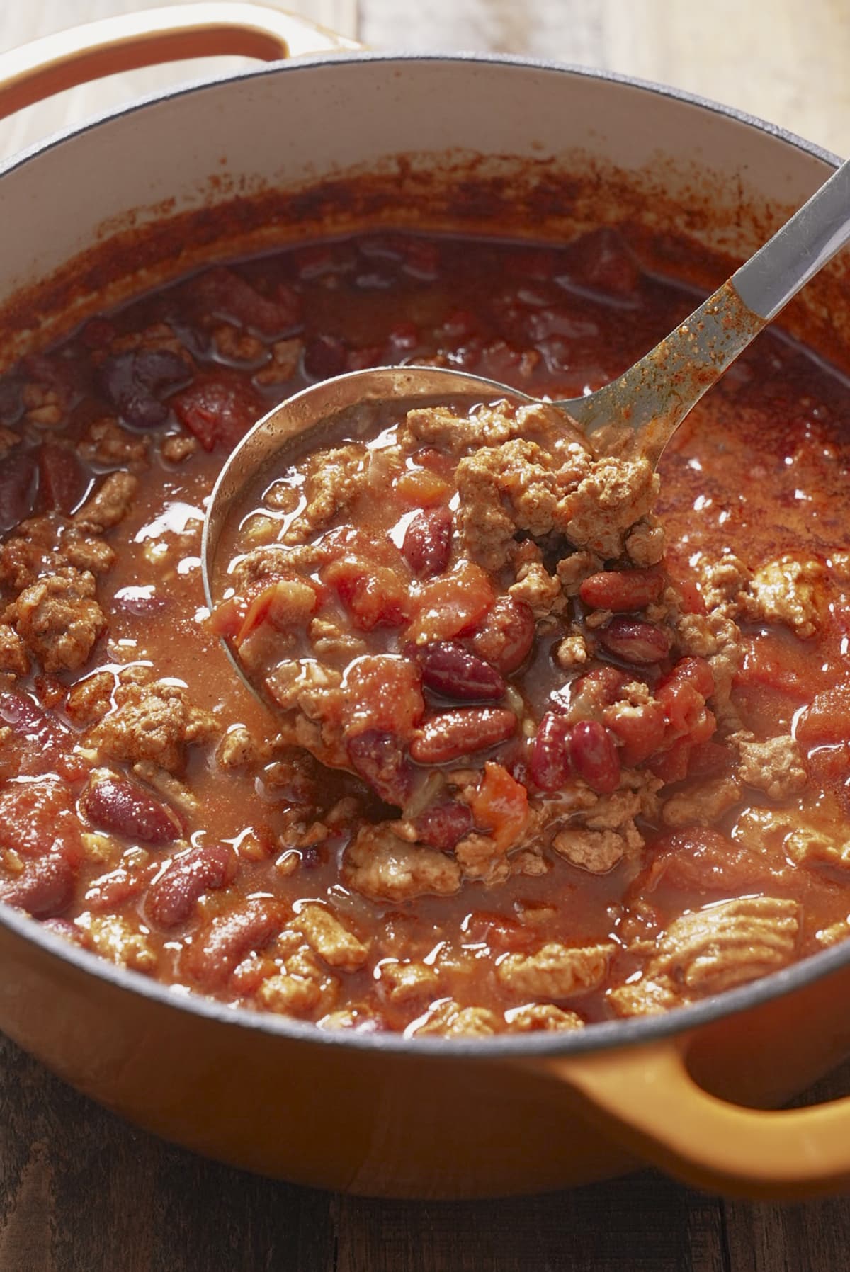 spoon picking up turkey chili