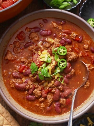 Turkey chili in a bowl with toppings