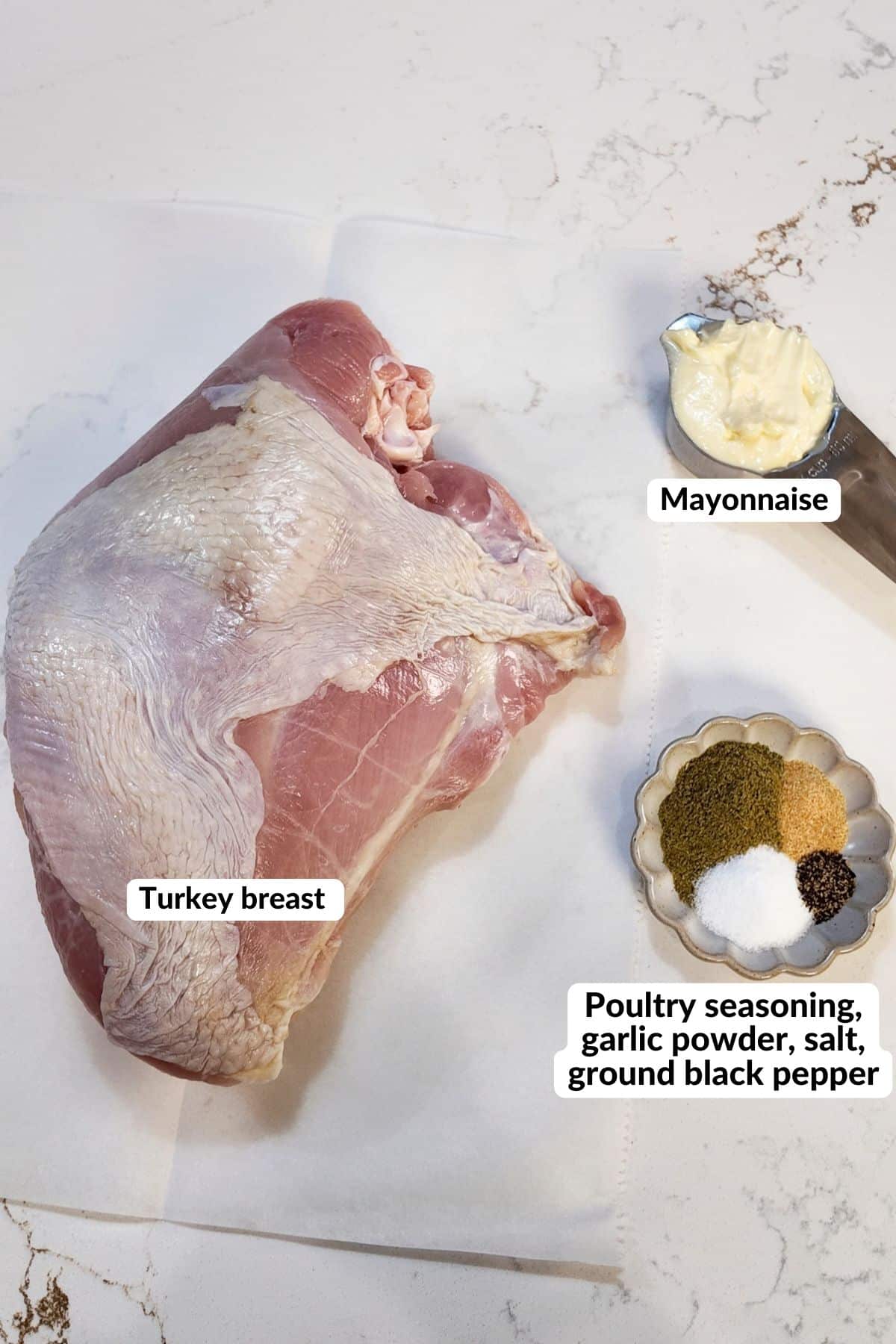 ingredients for the turkey breast in the air fryer, showing a half breast, seasonings, and mayonnaise